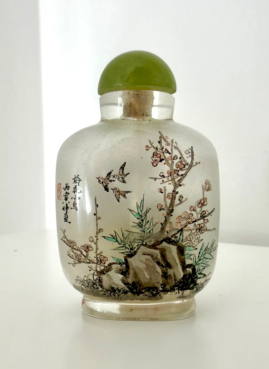 Chinese interior-painted glass snuff bottle with plum blossom and little ducks, jade-style stopper, in original silk case (7 cm approximately)